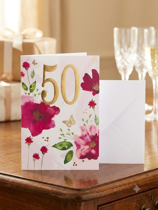 50th birthday card with gold foil numerals and watercolour pink and crimson florals with white envelope