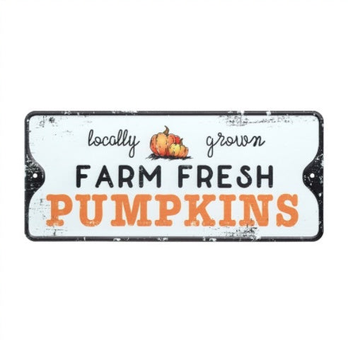 Distressed metal Farm Fresh Pumpkins sign with bold orange and black typography and pumpkin illustration