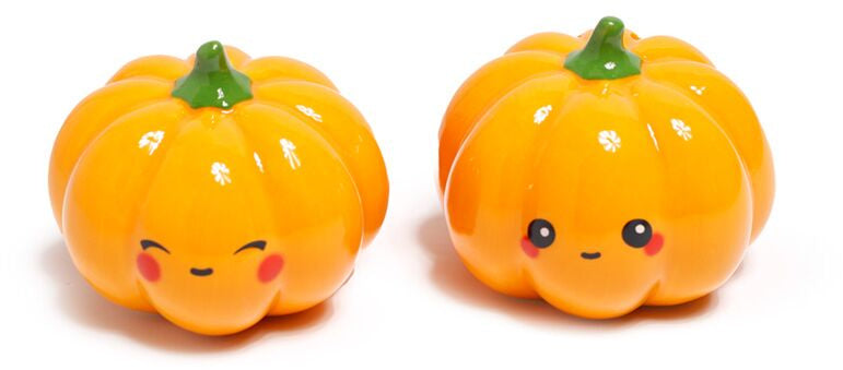 Set of two kawaii ceramic pumpkin salt and pepper shakers with winking and smiling faces and glossy orange glaze