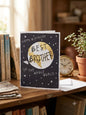 Happy Birthday Best Brother in the Whole World card — dark navy globe design with stars, warm lifestyle photo