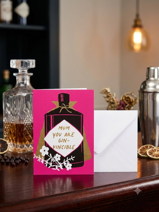 Mum You Are Gin-vincible birthday card — bold fuchsia pink gin bottle design, bar lifestyle photo with crystal decanter and cocktail shaker