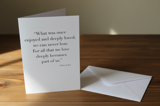 Helen Keller quote sympathy greeting card lifestyle photo on rustic wooden surface with white envelope