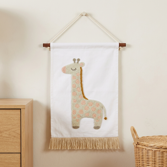 Sass & Belle giraffe fabric hanging decoration displayed in a neutral nursery setting.