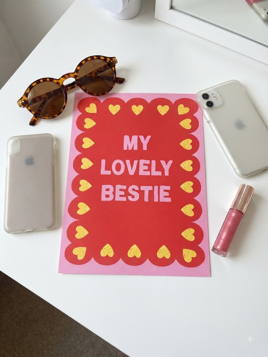 My Lovely Bestie card with bold pink lettering on red scalloped border with yellow hearts