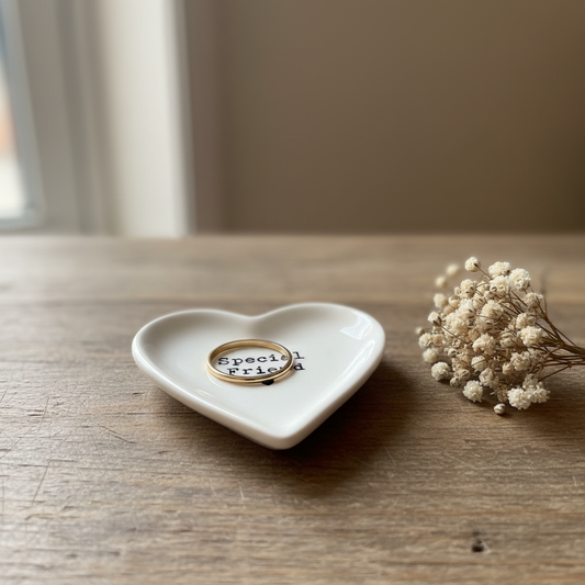 Special Friend ceramic heart trinket dish styled on a rustic wooden surface with dried flowers and a gold ring