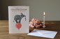 Special Granddaughter birthday card standing open spine-left in a cosy lifestyle setting