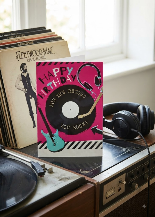 Happy Birthday For The Record You Rock card with vinyl record, guitar and headphones on hot pink background