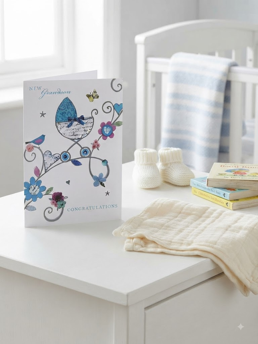 New Grandson Congratulations card with illustrated pram, florals and butterflies in soft blue and pink