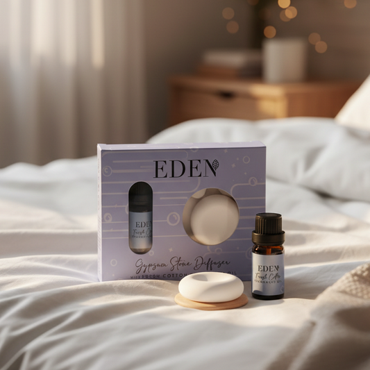 Eden Fresh Cotton gypsum stone diffuser on wooden coaster with fragrance oil in a cosy home setting