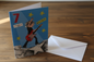 7 Today Rock Star guitar boy birthday card standing upright spine-left slightly open in a cosy lifestyle setting
