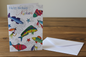 Happy Birthday Nephew fish card standing upright spine-left slightly open in a cosy lifestyle setting