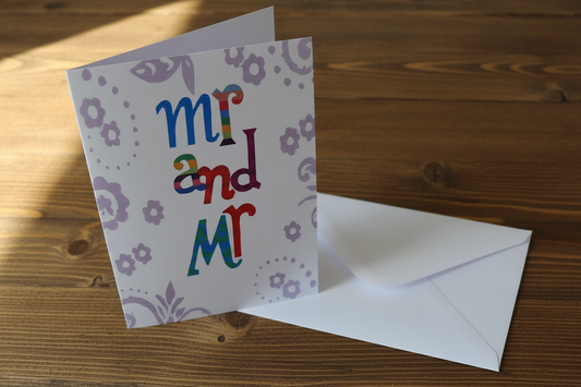 Mr and Mr wedding greeting card lifestyle photo on rustic wooden surface with white envelope
