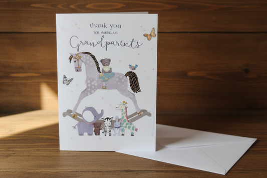 Thank you for making us Grandparents rocking horse card standing upright spine-left slightly open in a cosy lifestyle setting
