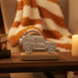 Silver metal Land Rover Defender ornament on a mango wood base