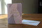 On Our Anniversary card standing upright spine-left slightly open in a cosy lifestyle setting