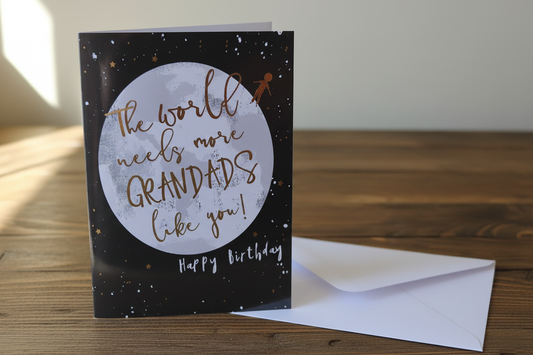 The World Needs More Grandads Like You moon card standing upright spine-left slightly open in a cosy lifestyle setting