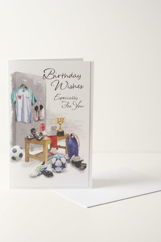 Football birthday card lifestyle shot – upright with white envelope, warm natural light