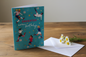 Daughter Happy Birthday football card standing open spine-left in a cosy lifestyle setting