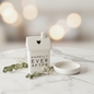 Happily Ever After ceramic house trinket styled on marble surface