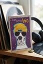 Happy Birthday Bro card with a cool Dalmatian in a yellow beanie and sunglasses on a purple background with gold stars
