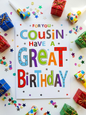Bright bold birthday card for a cousin reading For You Cousin Have a Great Birthday in multicoloured lettering with stars and confetti