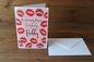 Anniversary Kisses Hubby card standing upright spine-left slightly open in a cosy lifestyle setting