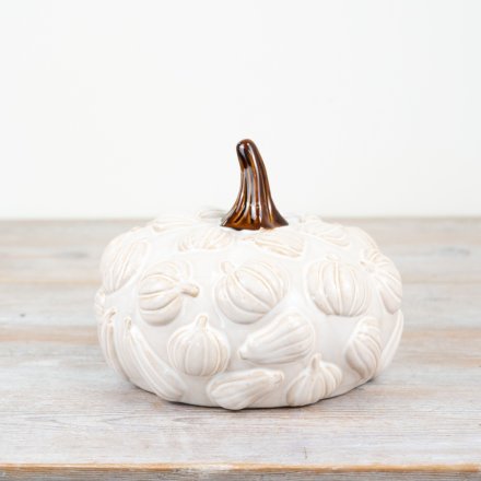 White ceramic pumpkin with raised leaf detailing and a brown stalk